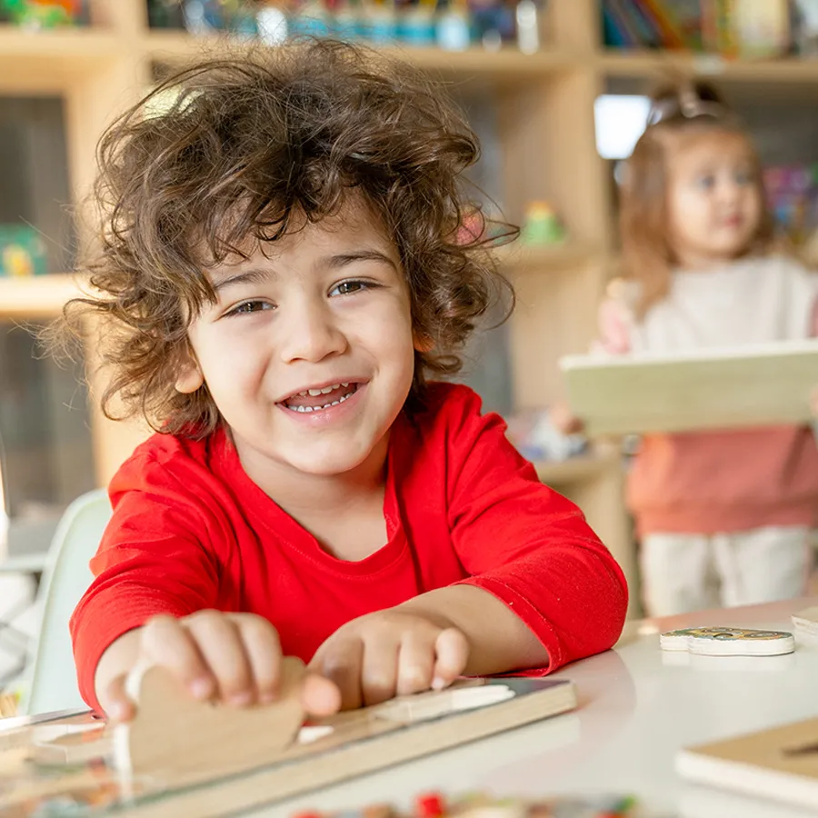 Child in kindergarten activity